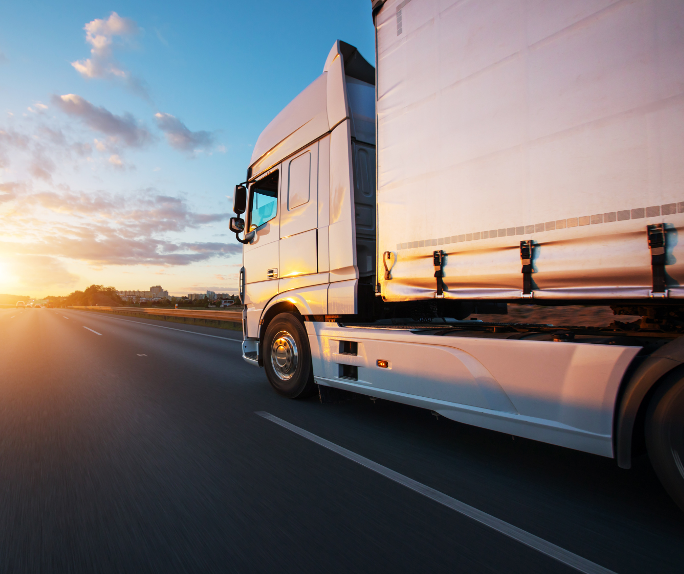 truck on the road with sunset